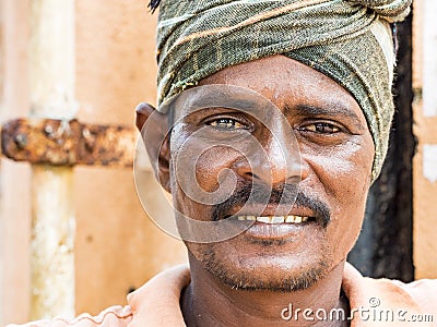 Portrait of unidentified Indian worker looking at camera with smile. Rural people daily lifestyle of India Editorial Stock Photo