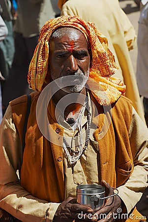 Portrait of an unidentified senior hindu man wearing glasses at the street in Orchha, India. Editorial Stock Photo