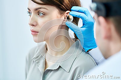 Audiologist Examining Ears Stock Photo