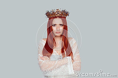 Portrait upset beauty queen, woman looking suspicious, disapproval on face arms crossed folded unhappy pretty woman with crystal Stock Photo