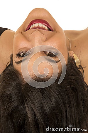 Portrait of upside down dark complected woman smiling Stock Photo