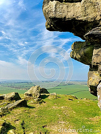 Portrait or vertical shot of Almscliffe Crag a millstone grit outcrop in North Yorkshire Stock Photo