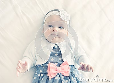 Portrait of very sweet little baby girl. Stock Photo