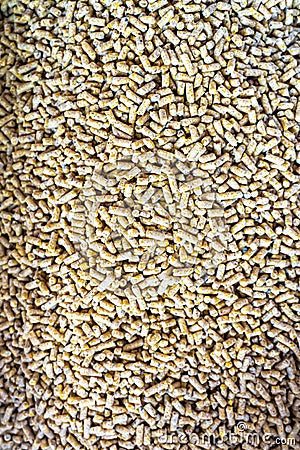 Portrait view of Chicken feed pellets, close up of granulated poultry food texture Stock Photo
