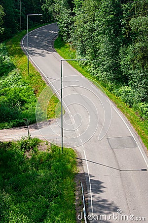 Portrait View of a Winding Concrete Road Stock Photo