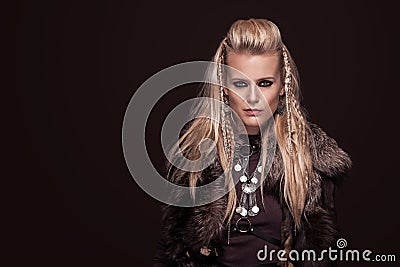 Portrait of viking woman in a traditional warrior clothes. Stock Photo