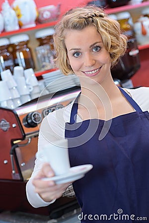 Portrait waitress holding cup Stock Photo