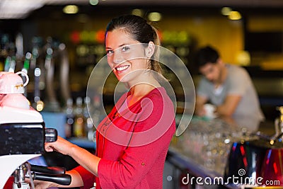 Portrait waitress using coffee machien Stock Photo