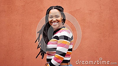 Portrait, wall and black woman with smile, fashion and freedom with joy, success and casual outfit. Face, Jamaican Stock Photo