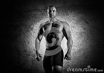 Portrait of a weightlifter who poses without a shirt. Stock Photo