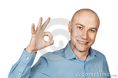 Portrait White bald man in blue shirt on a white isolated background showing sign okay Stock Photo