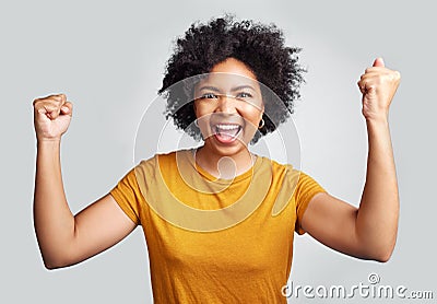 Portrait, winner and wow with a woman in studio on a gray background celebrating a victory or success. Motivation, smile Stock Photo