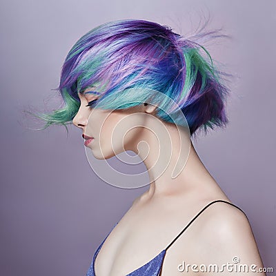 Portrait of a woman with bright colored flying hair, all shades of purple. Hair coloring, beautiful lips and makeup. Hair Stock Photo