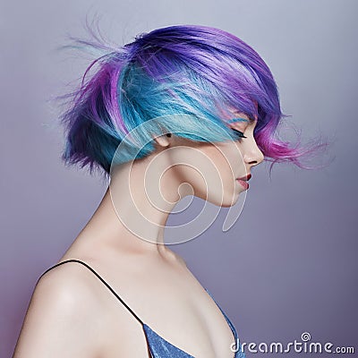 Portrait woman with bright colored flying hair, all shades of purple. Hair coloring, beautiful lips and makeup. Hair fluttering Stock Photo