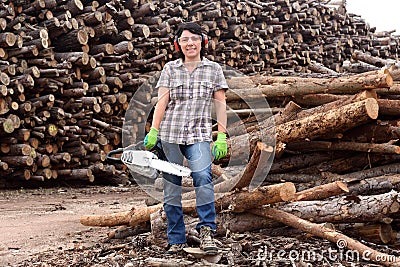 Portrait of a woman with a chainsaw Stock Photo