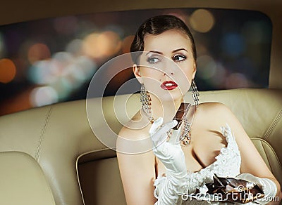 Portrait of a woman with chocolate in a car Stock Photo