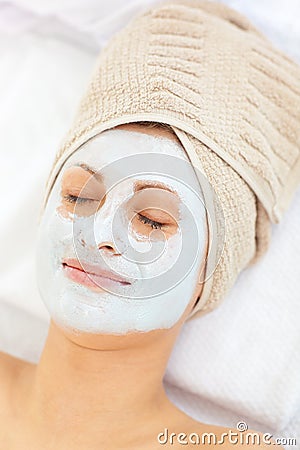 Portrait of a woman with clay mask on her face Stock Photo