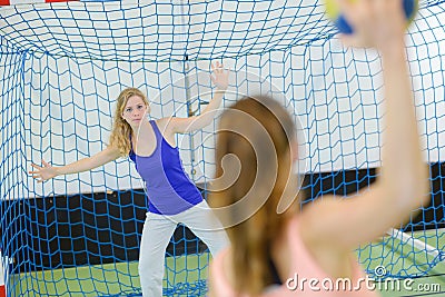 Portrait woman defending handball goal Stock Photo