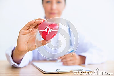 Portrait of woman doctor with holding red heart, Health care con Stock Photo