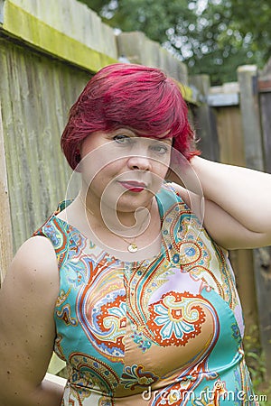 Portrait of woman in dress outdoors Stock Photo