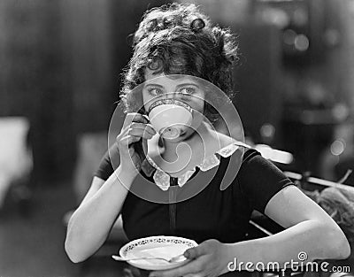 Portrait of woman drinking from teacup Stock Photo
