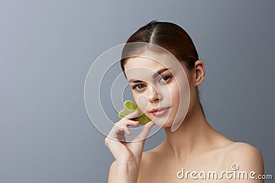 portrait woman facial scraper skin care posing close-up Lifestyle Stock Photo