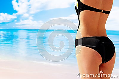 Portrait of woman having pretty bottom in bikini Stock Photo