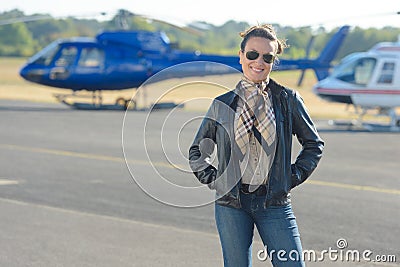 Portrait woman at helicopter landing pad Stock Photo