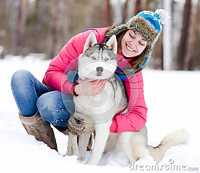 Portrait of a woman with her beautiful dog sitting Stock Photo