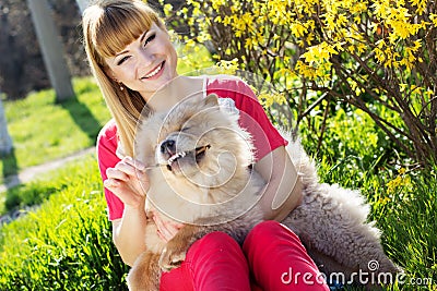 Portrait of a woman with her dog outdoors Stock Photo