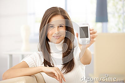 Portrait of woman holding cellphone Stock Photo