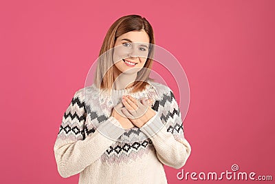 Portrait of woman holding hands near heart Stock Photo