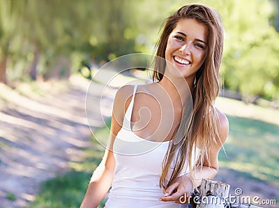 Portrait, woman or laugh for hair, fashion or summer in casual outfit with natural styling in park. Happy, female Stock Photo