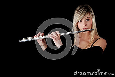 Portrait of a woman playing transverse flute Stock Photo