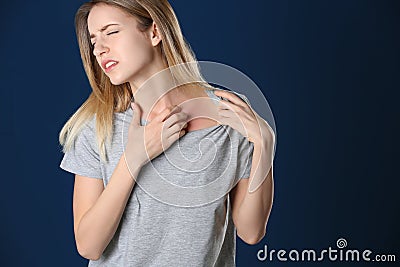 Portrait of woman scratching neck, space for text. Allergy symptom Stock Photo