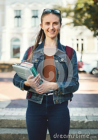 Portrait, woman student or holding books with smile, confident or ready for class studies. Course, young female or girl Stock Photo