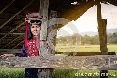 Portrait of woman tribal Lisu in traditional clothing and jewelry costume in cottage., Lifestyle of hill tribe girl in the north Stock Photo