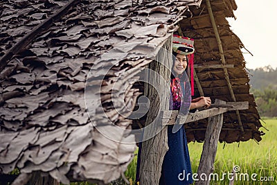 Portrait of Woman Tribal Lisu in Traditional Clothing and Jewelry Costume in Cottage., Lifestyle of Hill Tribe Girl in The North Stock Photo