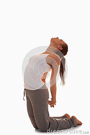 Portrait of a woman in the Ustrasana position Stock Photo