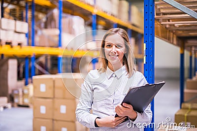 Portrait of a woman warehouse worker or supervisor. Stock Photo