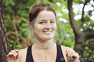 Portrait of a woman wearing silver metal earrings Stock Photo