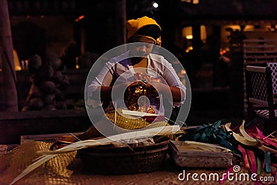 Woman weaving in Bali, Indonesia Editorial Stock Photo