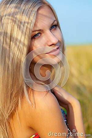 Portrait of woman on wheat field Stock Photo