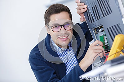 portrait worker calibrating printer Stock Photo