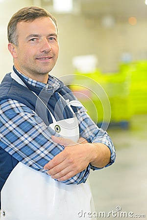 Portrait worker in waterproof apron Stock Photo