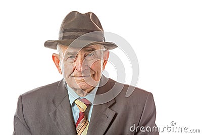 Portrait of 90 year old senior man in retro hat looking at camera isolated on white background Stock Photo