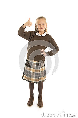 Portrait of 7 or 8 years old beautiful and happy schoolgirl female child in school uniform smiling cheerful isolated on white back Stock Photo