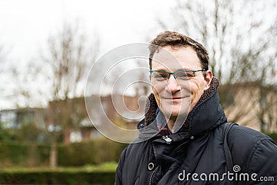 Portrait of a 40 yo white man in winter clothes with anature background Stock Photo