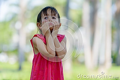 Stressed young multi ethnic girl looking bored and tired at the park outdoors Stock Photo