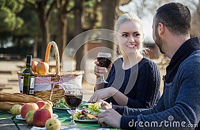 Portrait of young adults drinking wine outdoors Stock Photo